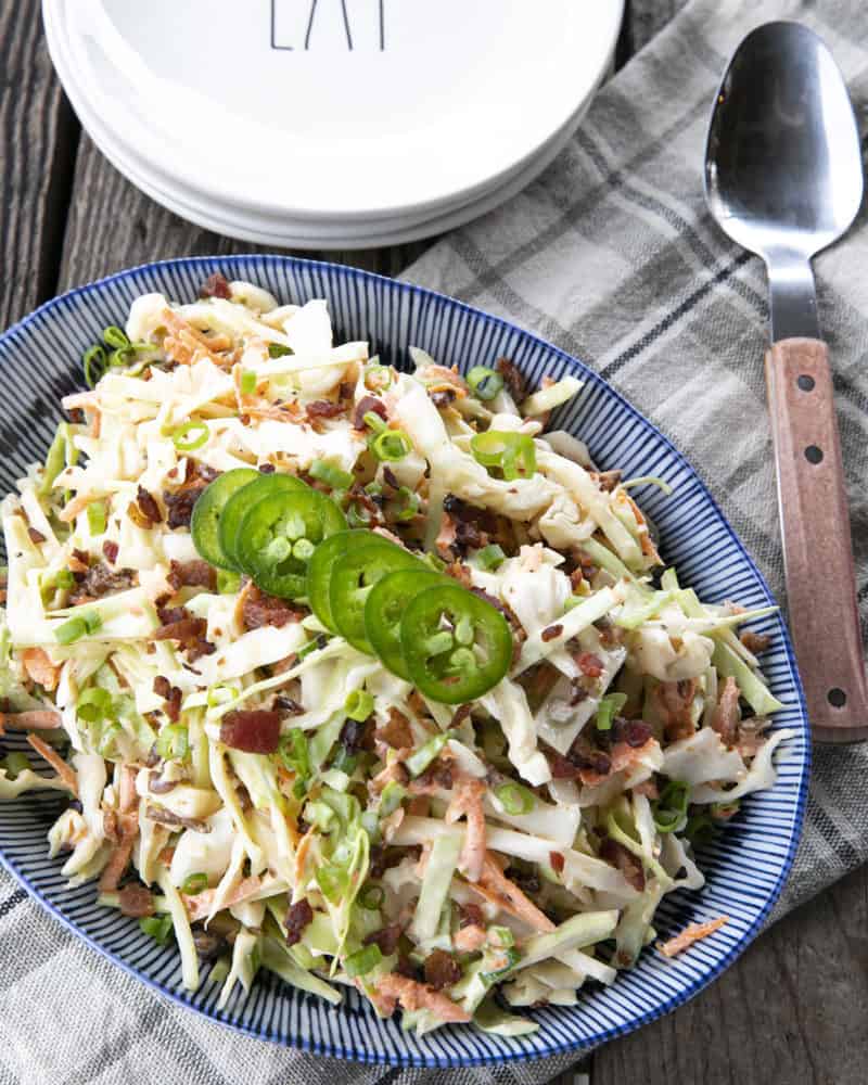 Jalapeno Coleslaw is a deliciously fresh, crunchy, savoury, summery salad to accompany all your grilled main dishes. Creamy, tangy, and easily adjustable to suit your heat-preferences, this super fresh spicy coleslaw is one you'll reach for again and again.