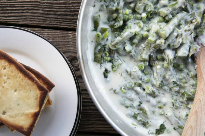 Tender spring peas and asparagus combine in a garden herb cream sauce in this new-fashioned take on delightfully old-fashioned Creamed Peas. Served over toast, this is one simple, economical dish wows!