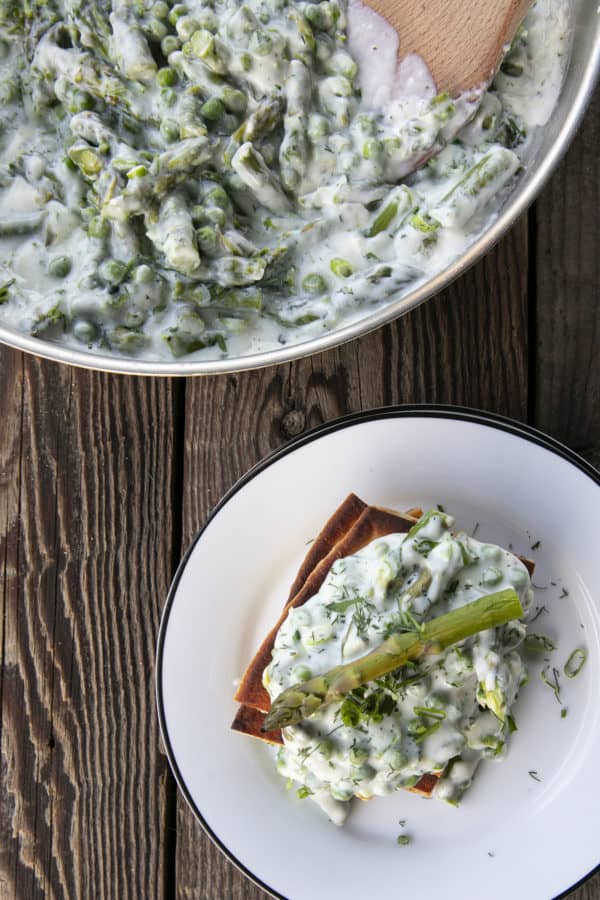 Tender spring peas and asparagus combine in a garden herb cream sauce in this new-fashioned take on delightfully old-fashioned Creamed Peas. Served over toast, this is one simple, economical dish wows!