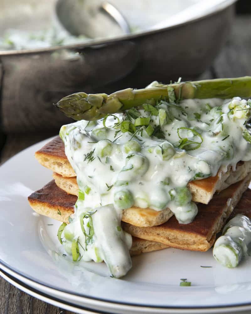 Tender spring peas and asparagus combine in a garden herb cream sauce in this new-fashioned take on delightfully old-fashioned Creamed Peas. Served over toast, this is one simple, economical dish wows!