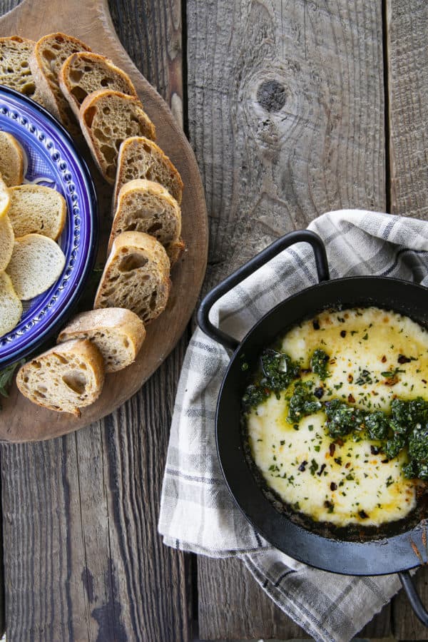 Provoleta -or Fried Cheese- is a delicious Argentinian cheese dish of pan-fried provolone cheese with crushed red pepper flakes and delicious garlic and herb chimichurri. An easier and more enticing appetizer simply doesn't exist!