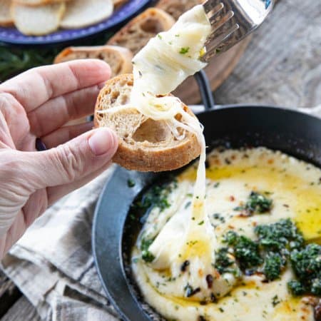 Provoleta -or Fried Cheese- is a delicious Argentinian cheese dish of pan-fried provolone cheese with crushed red pepper flakes and delicious garlic and herb chimichurri. An easier and more enticing appetizer simply doesn't exist!