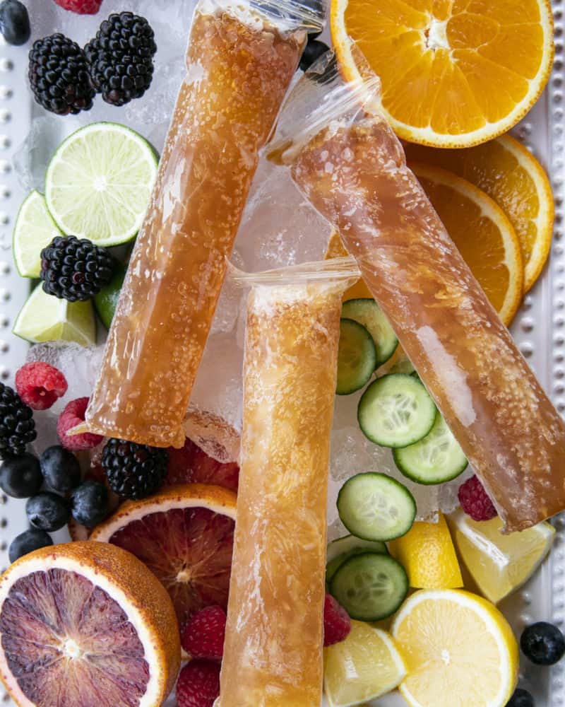 Pimm's Cup Recipe boozy popsicles are made of a gin-based liqueur, fizzy Prosecco, a hint of lemon and strawberry puree, and are guaranteed to refresh you!