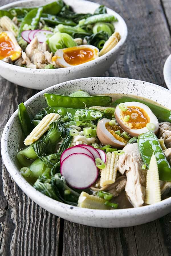 Instant Pot Chicken Ramen with jammy egg, baby corn, pea pods, bok choy, mushrooms, and radishes.