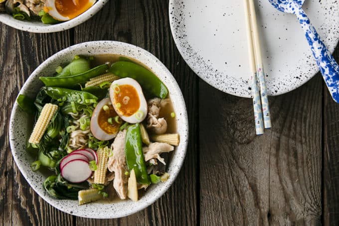 Instant Pot Chicken Ramen with jammy egg, baby corn, pea pods, bok choy, mushrooms, and radishes.