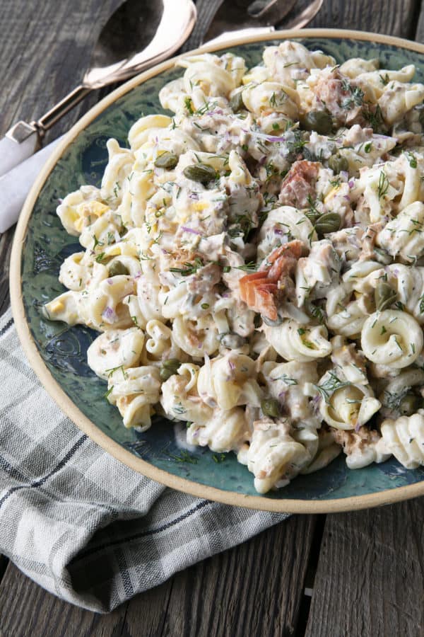 Smoked Salmon Pasta Salad is about to become your new favourite pasta salad. Savoury smoked salmon, a simple creamy dill dressing, hard-boiled eggs, capers, and red onions combine to amp up pasta salad to a whole new level. You'll find yourself craving this!