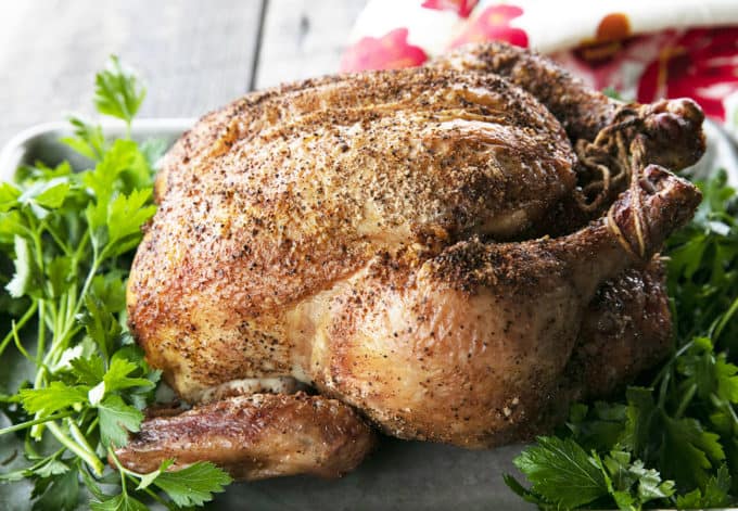 You will never believe how easy and spectacular this smoked whole chicken recipe is until you try it yourself. Full of tips and tricks, this post will help you make the best smoked chicken recipe you've ever had in your life!