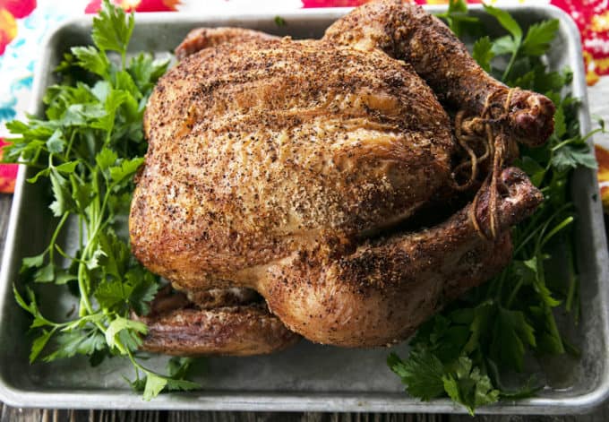 You will never believe how easy and spectacular this smoked whole chicken recipe is until you try it yourself. Full of tips and tricks, this post will help you make the best smoked chicken recipe you've ever had in your life!