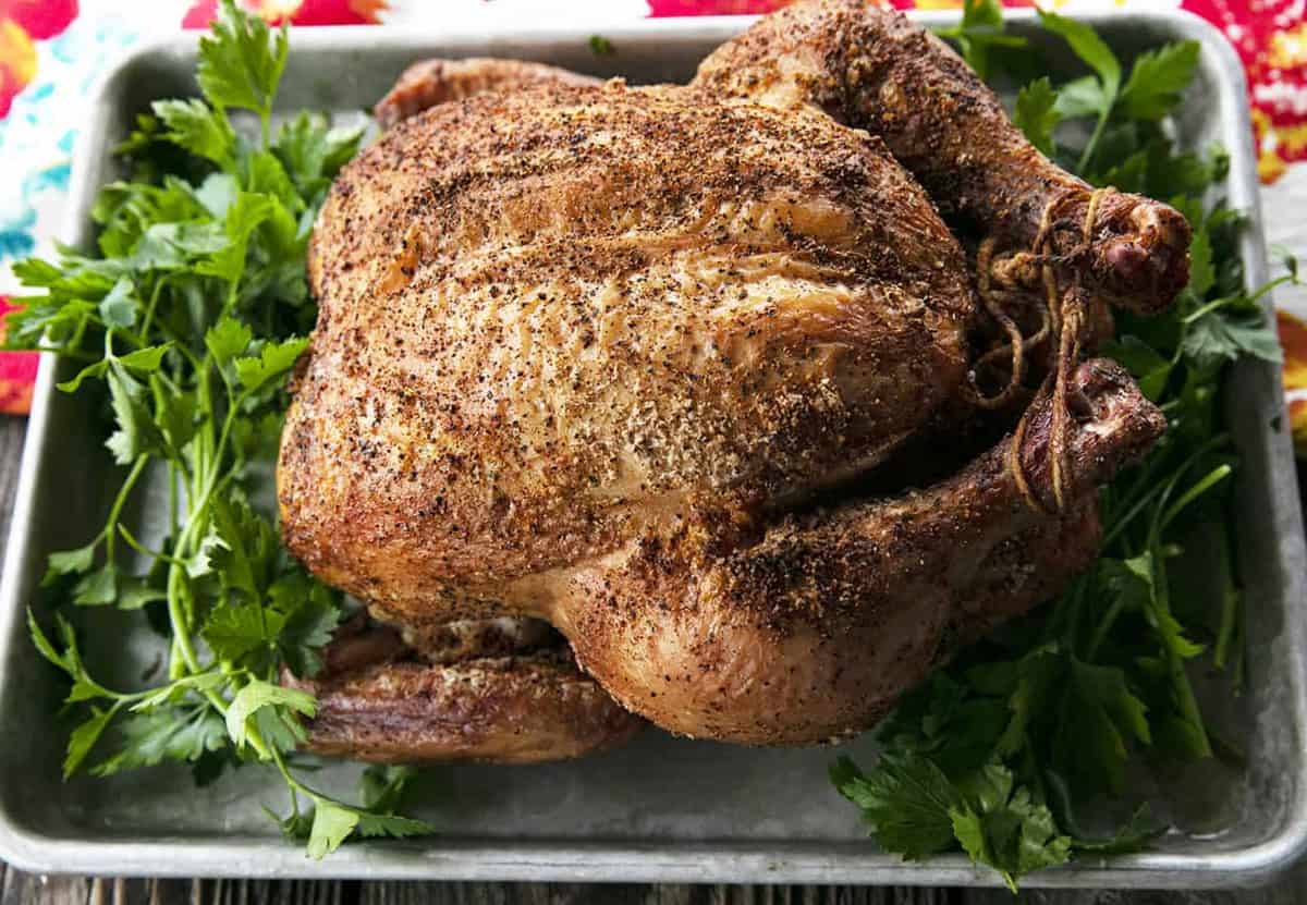 You will never believe how easy and spectacular this smoked whole chicken recipe is until you try it yourself. Full of tips and tricks, this post will help you make the best smoked chicken recipe you've ever had in your life!