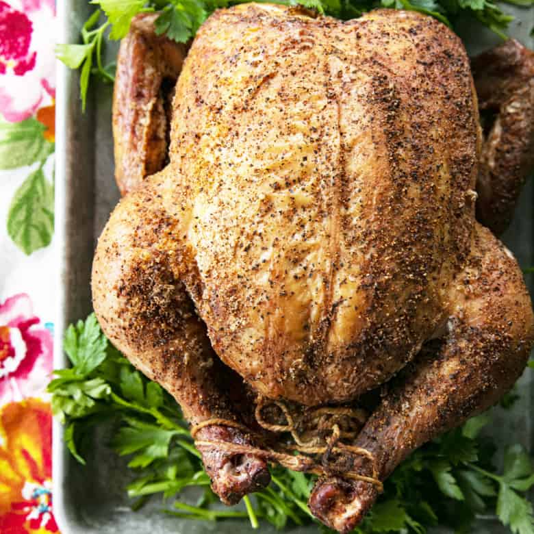 You will never believe how easy and spectacular this smoked whole chicken recipe is until you try it yourself. Full of tips and tricks, this post will help you make the best smoked chicken recipe you've ever had in your life!