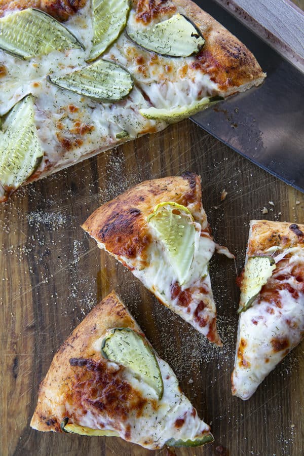 reamy garlic dill sauce, molten cheese, and a scandalous amount of garlicky dill pickles make this Pickle Pizza a memorable, delicious, and habit forming departure from your average pizza. Make with homemade pizza dough or store-bought dough, but do make it!