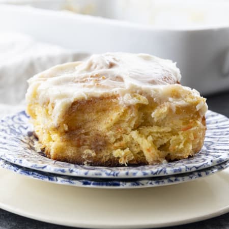 Carrot Cake Rolls are big, FLUFFY AS A CLOUD, & positively studded with super fine shreds of sweet carrots before being rolled up around a spiced buttery brown sugar filling.