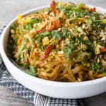 Chewy rice noodles scandalously loaded with crisp tender vegetables, a flavourful garlic and ginger sauce, and eggs make up our divine Rice Noodle Stir Fry.