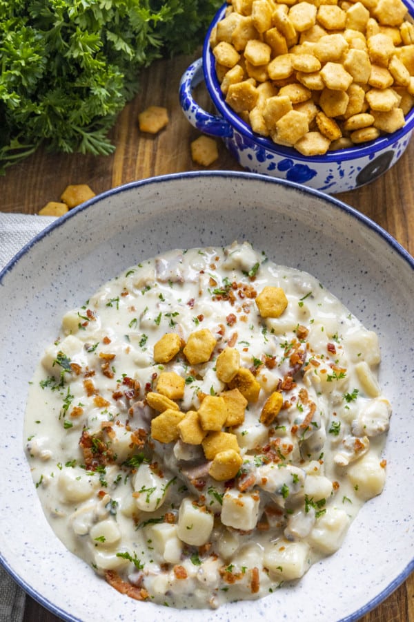 Old Bay Seasoned Oyster Crackers in a bowl and on New England Clam Chowder