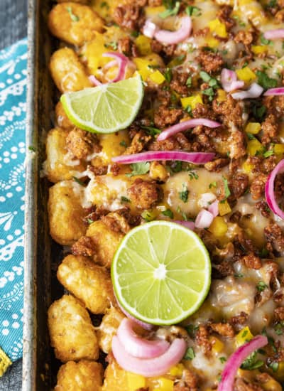 Change up Nacho Night by serving crave-ably good Tater Tot Nachos a.k.a. Totchos. These irresistible crispy baked tots are topped with spicy Chorizo, gooey melted Cheddar, pickled onions, and other nacho goodies!