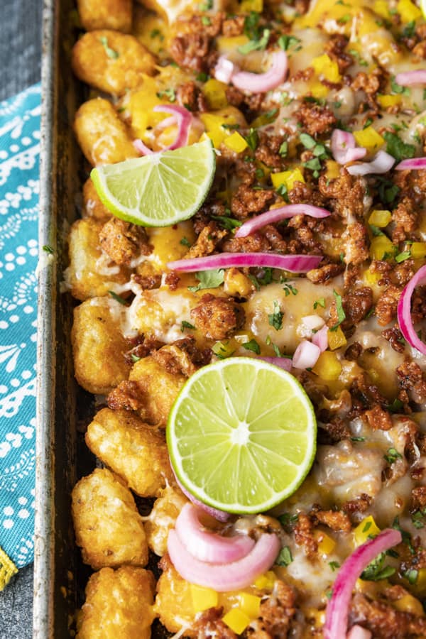 Change up Nacho Night by serving crave-ably good Tater Tot Nachos a.k.a. Totchos. These irresistible crispy baked tots are topped with spicy Chorizo, gooey melted Cheddar, pickled onions, and other nacho goodies!