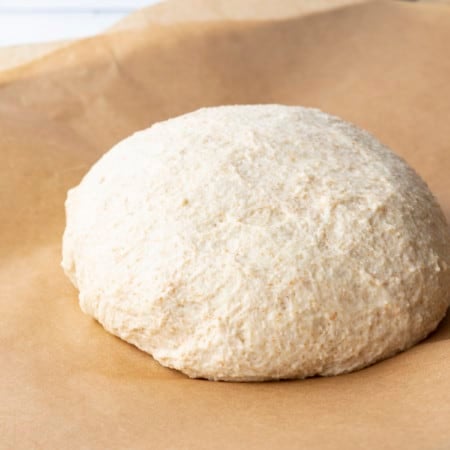 This whole wheat pizza dough yields our family's favourite pizza crust; crispy and chewy, flavourful crust that holds up to anything you put on it.