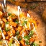 Tender cubes of Spicy Buffalo chicken, blue cheese crumbles or another cheese of your choice, thinly sliced green onions, and a drizzle of blue cheese dressing or ranch dressing top flatbread proving that great food doesn't have to be complicated! Buffalo Chicken Flatbread is equally fabulous as a great appetizer for game day or as an easy dinner.