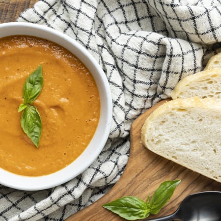 Super smooth, ultra Creamy Tomato Basil Soup is both the best and easiest way to make soup from fresh tomatoes. You’re going to love this so much, you’ll want to double, triple or even quadruple the recipe to keep on hand in the freezer long after summer and fresh tomatoes are a pleasant memory.