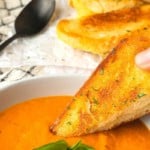 Super smooth, ultra Creamy Tomato Basil Soup is both the best and easiest way to make soup from fresh tomatoes. You’re going to love this so much, you’ll want to double, triple or even quadruple the recipe to keep on hand in the freezer long after summer and fresh tomatoes are a pleasant memory.