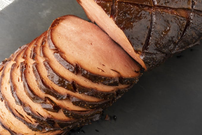 crispy-edged bologna on a hamburger bun or great homemade sandwich bread with mustard or mayo, lettuce, tomato, and a slab of sweet onion.