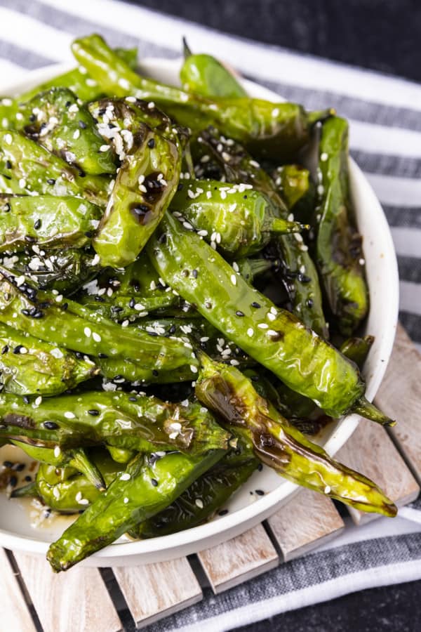 If you're looking for a great snack or the perfect appetizer, look no further than Shishito Peppers Air Fryer style. This super easy recipe for a tasty snack is made from simple ingredients and takes only 3 to 5 minutes of air frying.