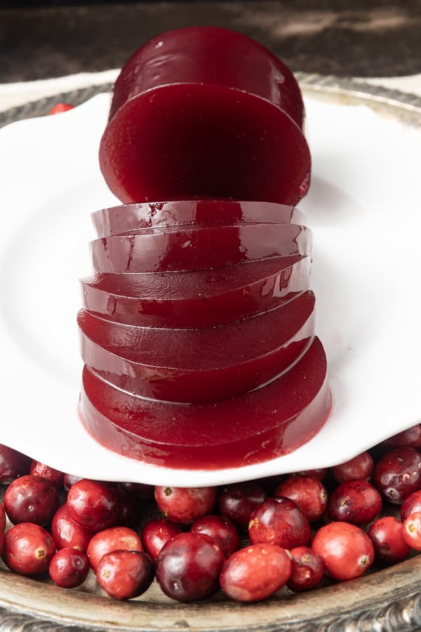 Delicious, nutritious homemade Jellied Cranberry Sauce with a hint of orange is just what your cranberry sauce lovers want at your Thanksgiving meal this holiday season! Tangy, sweet, and a holiday classic, your own cranberry sauce is the perfect complement to any roast you serve! Serve this delightful homemade cranberry sauce right after it has been made and chilled, or you can can it to make it shelf-stable for longer storage. And it's easy to make to boot!