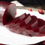 Delicious, nutritious homemade Jellied Cranberry Sauce with a hint of orange is just what your cranberry sauce lovers want at your Thanksgiving meal this holiday season! Tangy, sweet, and a holiday classic, your own cranberry sauce is the perfect complement to any roast you serve! Serve this delightful homemade cranberry sauce right after it has been made and chilled, or you can can it to make it shelf-stable for longer storage. And it's easy to make to boot!