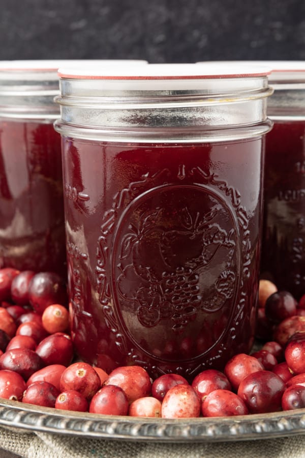 Delicious, nutritious homemade Jellied Cranberry Sauce with a hint of orange is just what your cranberry sauce lovers want at your Thanksgiving meal this holiday season! Tangy, sweet, and a holiday classic, your own cranberry sauce is the perfect complement to any roast you serve! Serve this delightful homemade cranberry sauce right after it has been made and chilled, or you can can it to make it shelf-stable for longer storage. And it's easy to make to boot!