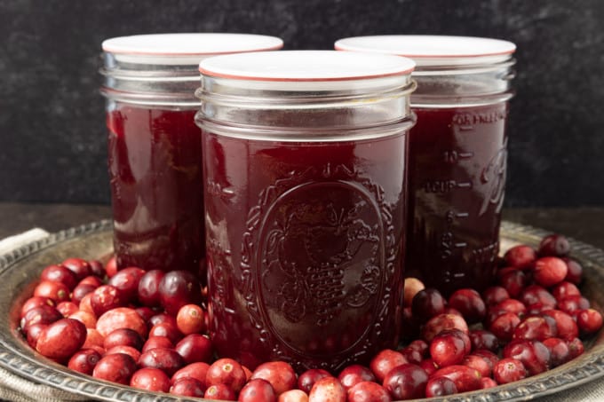 Delicious, nutritious homemade Jellied Cranberry Sauce with a hint of orange is just what your cranberry sauce lovers want at your Thanksgiving meal this holiday season! Tangy, sweet, and a holiday classic, your own cranberry sauce is the perfect complement to any roast you serve! Serve this delightful homemade cranberry sauce right after it has been made and chilled, or you can can it to make it shelf-stable for longer storage. And it's easy to make to boot!