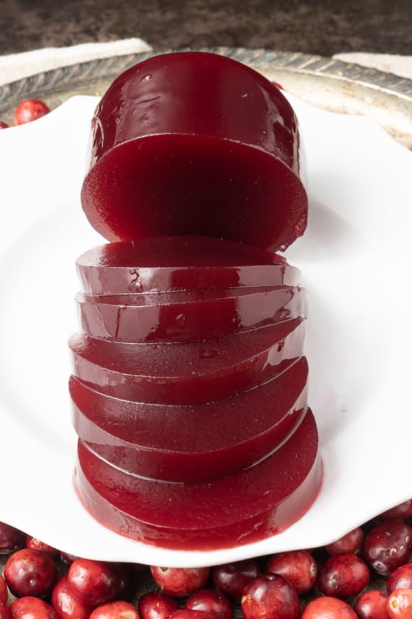 Delicious, nutritious homemade Jellied Cranberry Sauce with a hint of orange is just what your cranberry sauce lovers want at your Thanksgiving meal this holiday season! Tangy, sweet, and a holiday classic, your own cranberry sauce is the perfect complement to any roast you serve! Serve this delightful homemade cranberry sauce right after it has been made and chilled, or you can can it to make it shelf-stable for longer storage. And it's easy to make to boot!