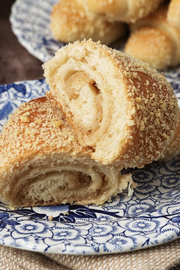 Tender milk bread, a swirl of mildly cinnamon scented caramel-like filling, and a topping of crispy crumbs all combine to make Senorita Bread; a classic Filipino popular afternoon snack that's beloved by all ages. There's nothing quite like a Señorita roll with your cup of coffee, tea, or even dipped into cold milk. Filipino cuisine is a delicious amalgam of the many cultures that have impacted the Philippines over its history whether through trade, conquest, or political influence. It's impossible to cover all of these within the confines of a little blog post about a delicious bread roll with sweet buttery filling.