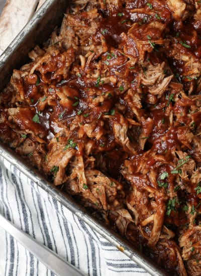 Today’s slow cooker recipe for Jack Daniels Pulled Pork is my go-to; it’s a reliable, easy recipe for the best pulled pork ever. Budget-friendly succulent pork shoulder slow cooks in Jack Daniels forming an irresistible whiskey bbq sauce. I mean honestly. How could this be anything less than sublime?