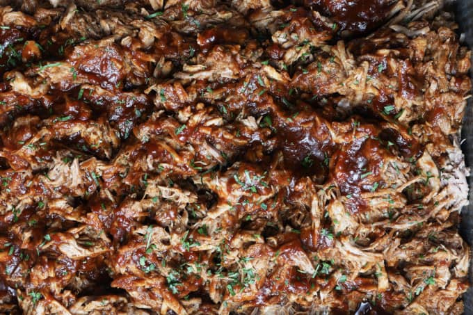 Today’s slow cooker recipe for Jack Daniels Pulled Pork is my go-to; it’s a reliable, easy recipe for the best pulled pork ever. Budget-friendly succulent pork shoulder slow cooks in Jack Daniels forming an irresistible whiskey bbq sauce. I mean honestly. How could this be anything less than sublime?