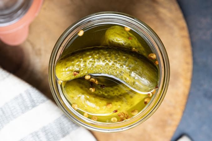 Moonshine pickles might sound crazy, but these high-octane pickles and their brine make cocktail time infinitely more exciting. Crunchy, delicious, and ever-so delicious, you can snack on the pickles then take a shot of the brine! Where are my pickle loving party people? Because not only are these dill-icious, but they’re about as easy as 1-2-3.