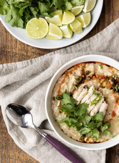 Chao Ga is a savoury, silky, thick, comforting, and filling Vietnamese chicken and rice soup or porridge that is as easy to make as it is budget friendly! Whether you serve this chicken congee for breakfast, lunch, or dinner, you’re going to love the fresh, vibrant Vietnamese flavours in this fast, fabulous, delicious dish. For an aromatic dish that bursts with flavour, this recipe is shockingly easy to prepare. And while it will undoubtedly fill you up, it’ll do so for pennies and won’t leave you feeling weighed down.