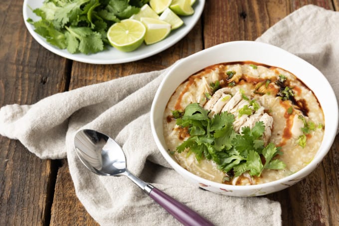 Chao Ga is a savoury, silky, thick, comforting, and filling Vietnamese chicken and rice soup or porridge that is as easy to make as it is budget friendly! Whether you serve this chicken congee for breakfast, lunch, or dinner, you’re going to love the fresh, vibrant Vietnamese flavours in this fast, fabulous, delicious dish. For an aromatic dish that bursts with flavour, this recipe is shockingly easy to prepare. And while it will undoubtedly fill you up, it’ll do so for pennies and won’t leave you feeling weighed down.