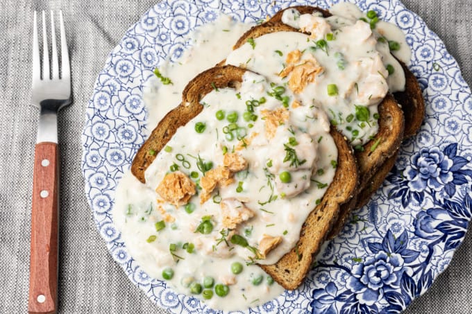 This comforting, delicious creamed salmon recipe is unapologetically old-fashioned. Served over your favourite toast, rice, or hot egg noodles, you can’t beat this ultra-fast meal option for breakfast, lunch, or dinner. This is an ultra budget friendly version of classic salmon in cream sauce. You can make it as written or make it your own by getting creative! The recipe includes some delicious variations on the theme and ideas for substituting ingredients.