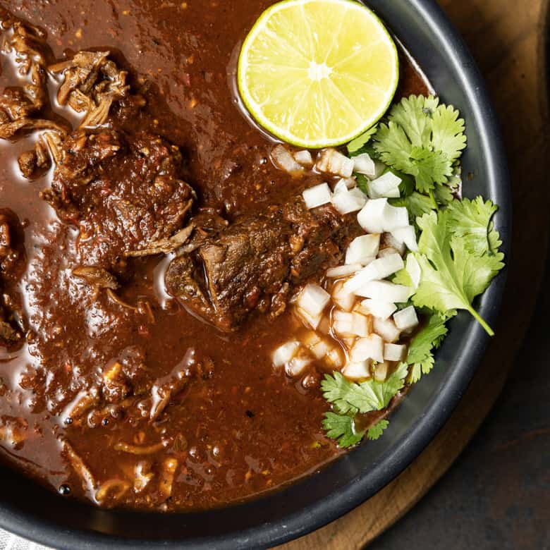 Instant Pot Birria makes fast work of the complex, rich, flavourful Mexican stewed or braised meat that is Birria. While traditional birria is made with goat marinated and then simmered for hours, our version of “birria de res” is done in a fraction of the time and made with more readily available beef.