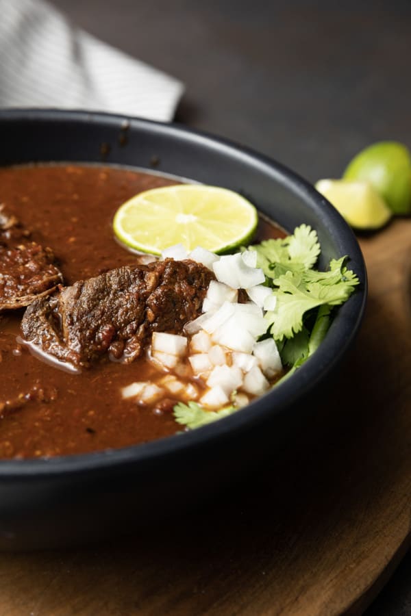 Instant Pot Birria makes fast work of the complex, rich, flavourful Mexican stewed or braised meat that is Birria. While traditional birria is made with goat marinated and then simmered for hours, our version of “birria de res” is done in a fraction of the time and made with more readily available beef.
