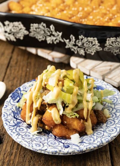 Big Mac Casserole: Saucy ground beef that tastes just like a Big Mac topped with melty cheese and tater tots then baked to bubbly, crispy tater tots topped perfection. This delicious meal the whole family will love is served with your favorite burger toppings like fistfuls of shredded lettuce, diced onion and dill pickle, and drizzled with "special sauce" or thousand island dressing. And while this twist on classic comfort food might sound weird, it is a great family dinner.