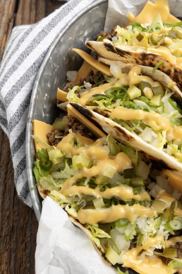 Big Mac Tacos: bringing “the golden arches” to taco night with irresistible tacos filled with seasoned beef, special sauce, lettuce, cheese, pickles, and onions on a sesame seed… tortilla. It’s everything you love about Big Macs in taco form and you don’t even have to leave the house to indulge!