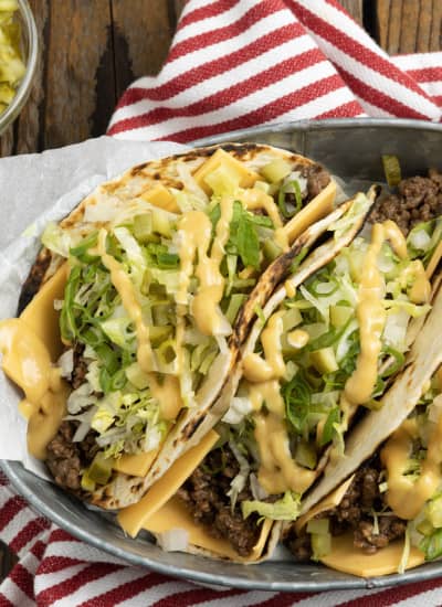 Big Mac Tacos: bringing “the golden arches” to taco night with irresistible tacos filled with seasoned beef, special sauce, lettuce, cheese, pickles, and onions on a sesame seed… tortilla. It’s everything you love about Big Macs in taco form and you don’t even have to leave the house to indulge!