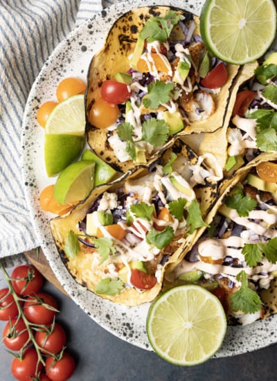 Taco seasoning rubbed cod is the star of these lightning fast, terrifically easy Air Fryer Fish Tacos. Done in about 15 minutes from start to finish these fish tacos are going to be a new favourite busy weeknight meal!