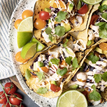 Taco seasoning rubbed cod is the star of these lightning fast, terrifically easy Air Fryer Fish Tacos. Done in about 15 minutes from start to finish these fish tacos are going to be a new favourite busy weeknight meal!