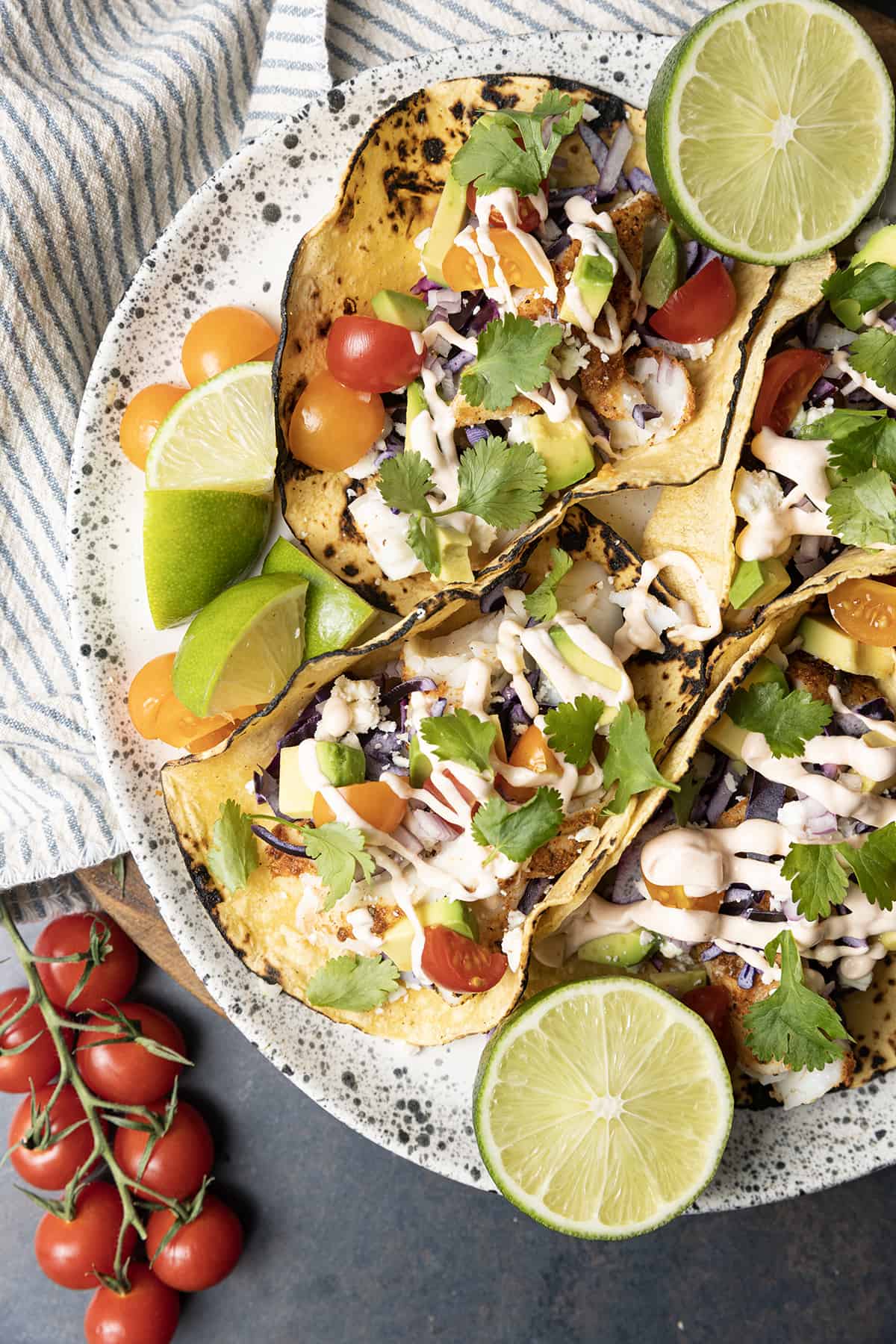 Taco seasoning rubbed cod is the star of these lightning fast, terrifically easy Air Fryer Fish Tacos. Done in about 15 minutes from start to finish these fish tacos are going to be a new favourite busy weeknight meal!