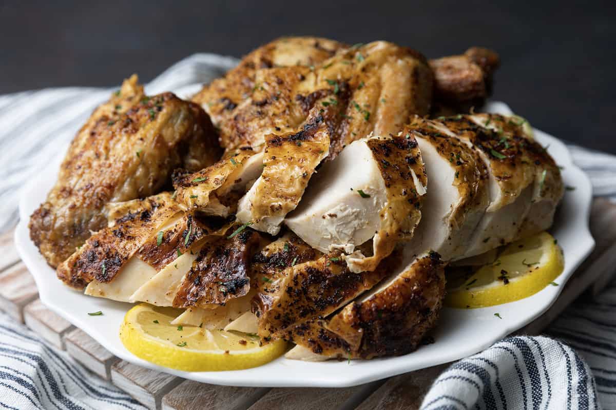 https://www.foodiewithfamily.com/wp-content/uploads/2023/03/air-fryer-whole-chicken-1.jpg