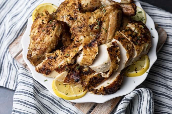 Crisp skinned and succulent, this air fryer whole chicken will become a weeknight regular thing. It is faster than oven roasting and creates a juicy, tender rotisserie style chicken! Let the air fryer do the work for you! This is one of my all time favourite ways to cook a whole chicken. It honestly doesn’t get any easier (or tastier!) than this and the whole family loves it.