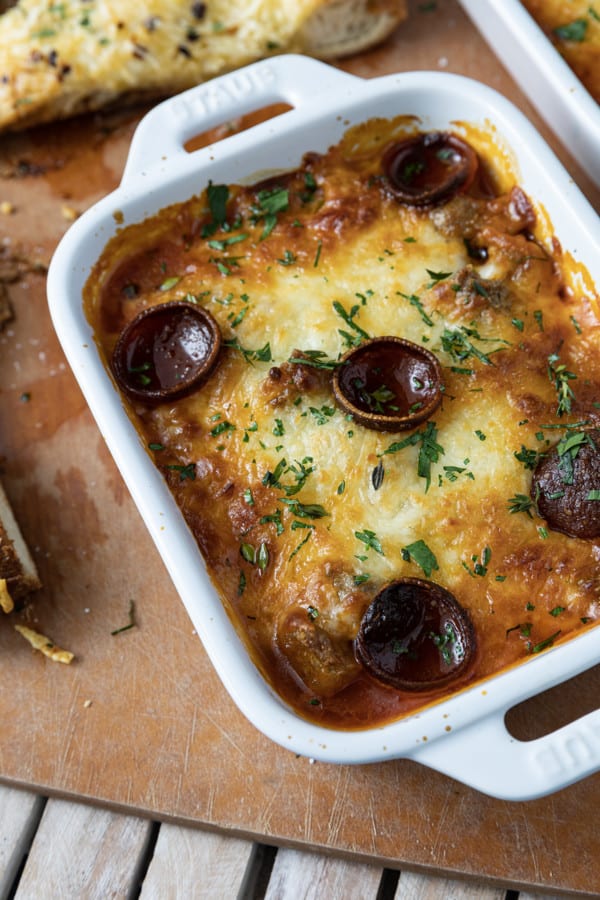 There’s no easier, more comforting dinner on the fly than this easy pizza bowl recipe! Garlicky marinara sauce, mozzarella cheese, pepperoni, succulent Italian sausage, and whatever else you love as pizza toppings are baked in individual servings until the cheese is bubbling and melted and the pepperoni is crispy at the edges.