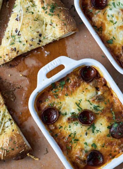 There’s no easier, more comforting dinner on the fly than this easy pizza bowl recipe! Garlicky marinara sauce, mozzarella cheese, pepperoni, succulent Italian sausage, and whatever else you love as pizza toppings are baked in individual servings until the cheese is bubbling and melted and the pepperoni is crispy at the edges.